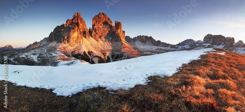 Gorgeous sunny view of Dolomite Alps with first snow. National Nature Park Tre Cime In the Dolomites Alps. Beautiful nature of Italy. Spring sunrise. . Beauty of nature concept background.