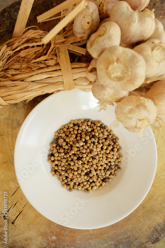 Garlic, pepper and dry chili main ingredient of cooking Thai food preparation by blending and mixing in stone mortar and mix in meat, pork or chicken for cooking Thai curry, have space for write wordi photo