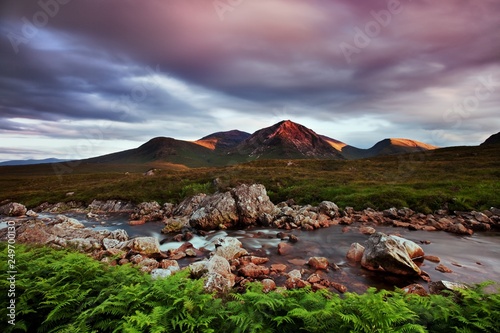 View towards Rannoch Moor, River Coupall in foreground, Beinn a' Chrulaiste on left. Highland, Scotland, UK. The mountain is Buachaille Etive Mor. It is located in Glencoe in the Lochaber region photo