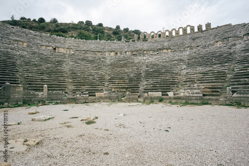 Historical site of Perge or Perga in Antalya, Turkey. Ancient stage of theatre. Vast remains of prosperous Roman city. Ancient Perge city existed from X century before Christ till VIII of our era.  photo