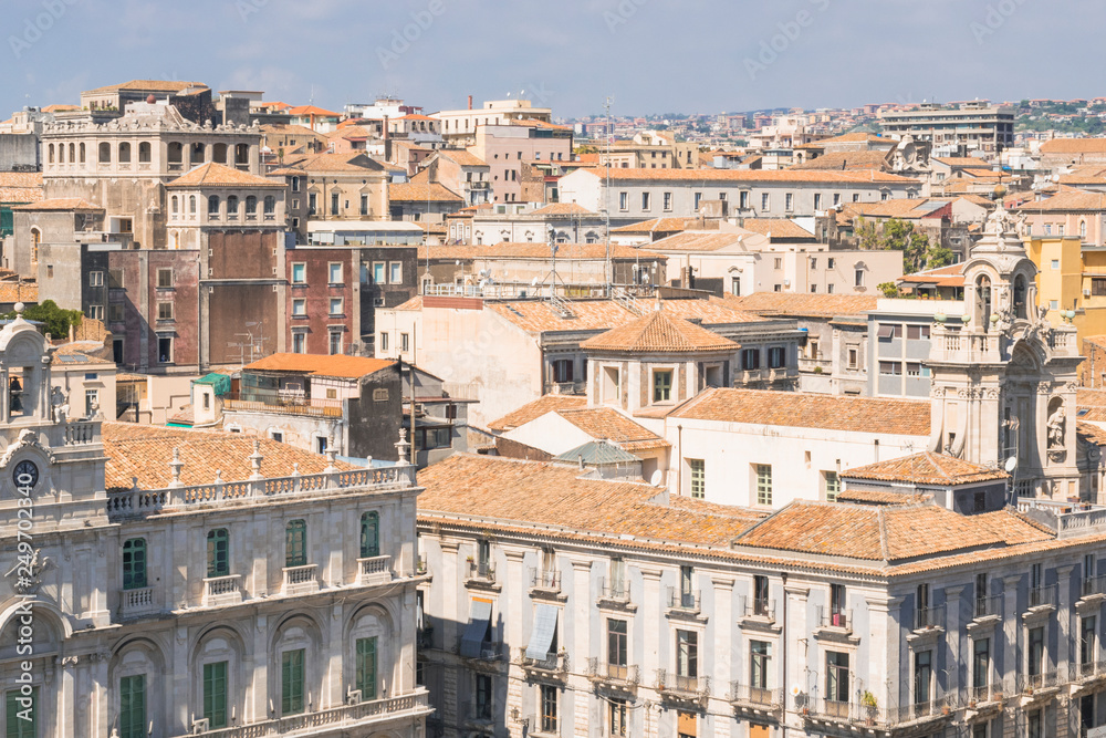 Aerial skyline panoramic view of city of Catania in September,  old town featuring brown, ochre and yellow roofs. Sicily, Italy. Vintage or travel background.