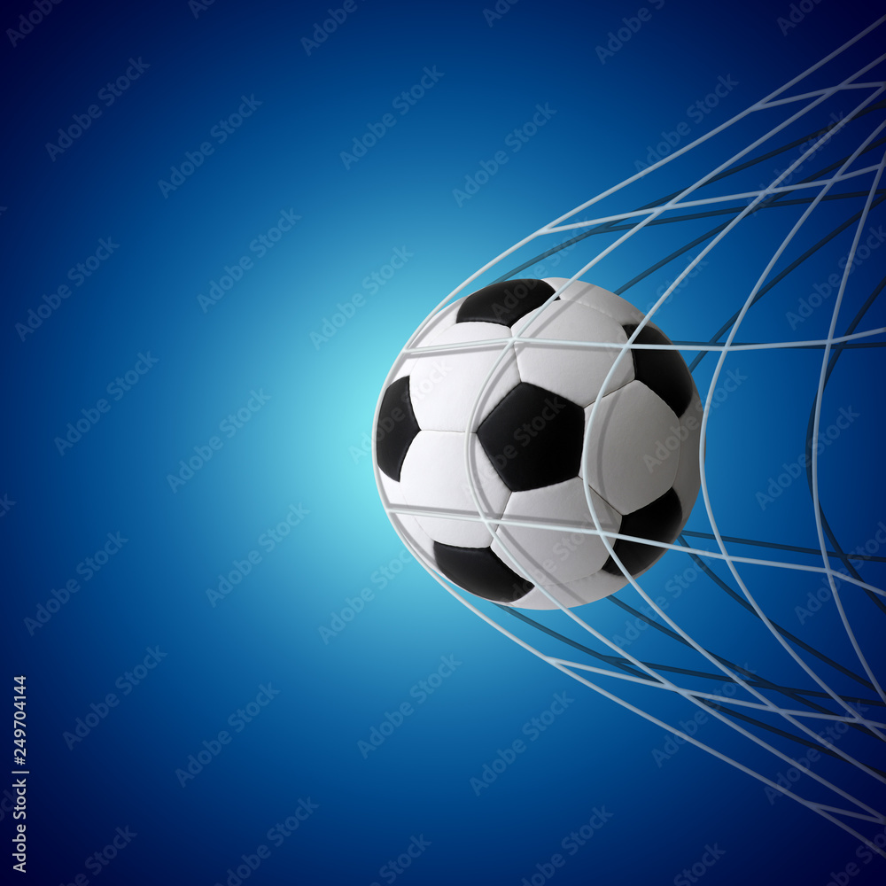 Soccer ball in goal on blue