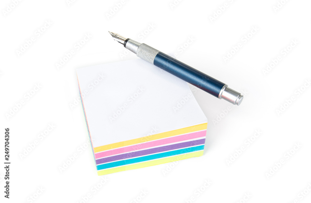 Pile of sticky note on a white background with a pen Pile of sticky note on a white background with a pen