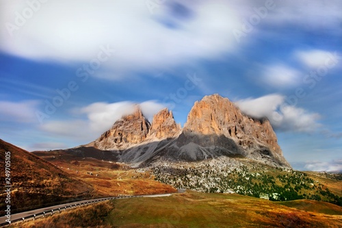 rgeous sunny view of Dolomite Alps. Colorful autumn scene of Marmolada mountain range. Sella pass location, Italy, Europe. Beauty of nature concept background. Cortina d ampezzo