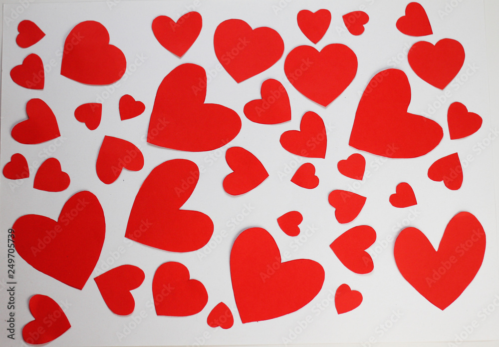 Red paper hearts on white background. Top view. Valentine's Day. Symbol of love.