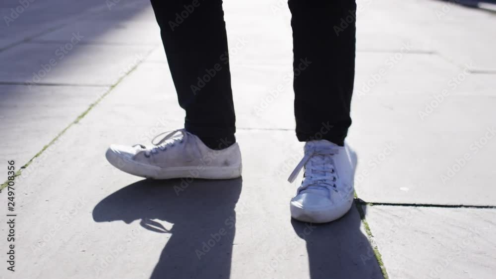 Close shot of feet dancing in the street Close shot of feet dancing in the street
