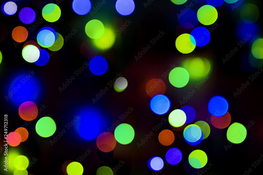 Bokeh. Holiday background. Garland. Christmas lights. Defocused sparkles Bokeh. Holiday background. Garland. Christmas lights. Defocused sparkles