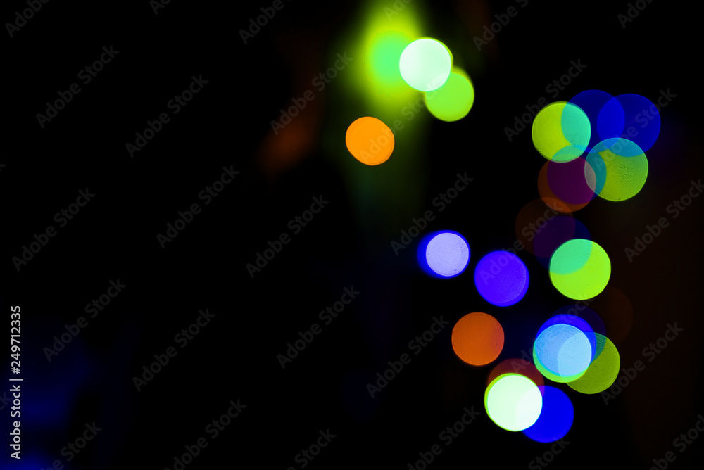 Fototapeta premium Bokeh. Holiday background. Garland. Christmas lights. Defocused sparkles