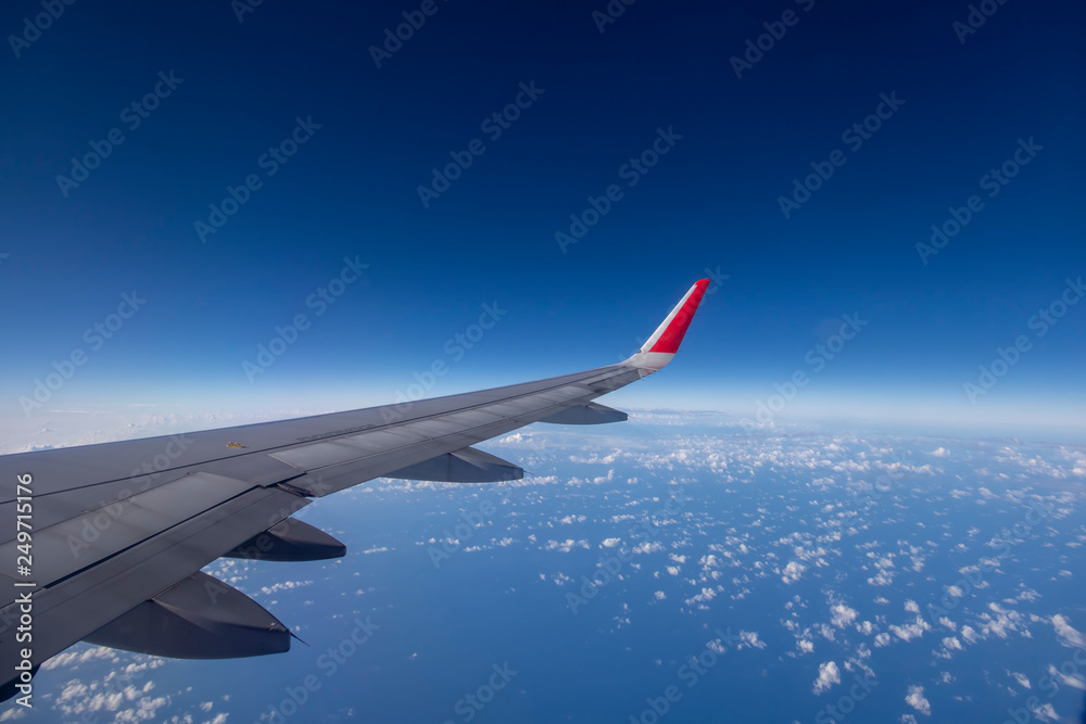 Aeroplane wing view from window beautiful sky. Traveling concept Aeroplane wing view from window beautiful sky. Traveling concept
