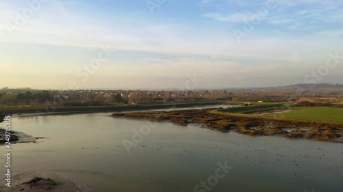 Aerial sequence depicting the wetlands at Hawbush Creek, South Woodham Ferrers with its diverse wildlife and waterfowl. Popular with walkers, visitors and naturalists alike.