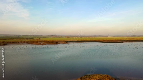 Aerial sequence depicting the wetlands at Hawbush Creek, South Woodham Ferrers with its diverse wildlife and waterfowl. Popular with walkers, visitors and naturalists alike.