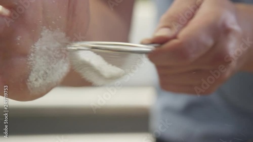 Sifting confectioners sugar photo