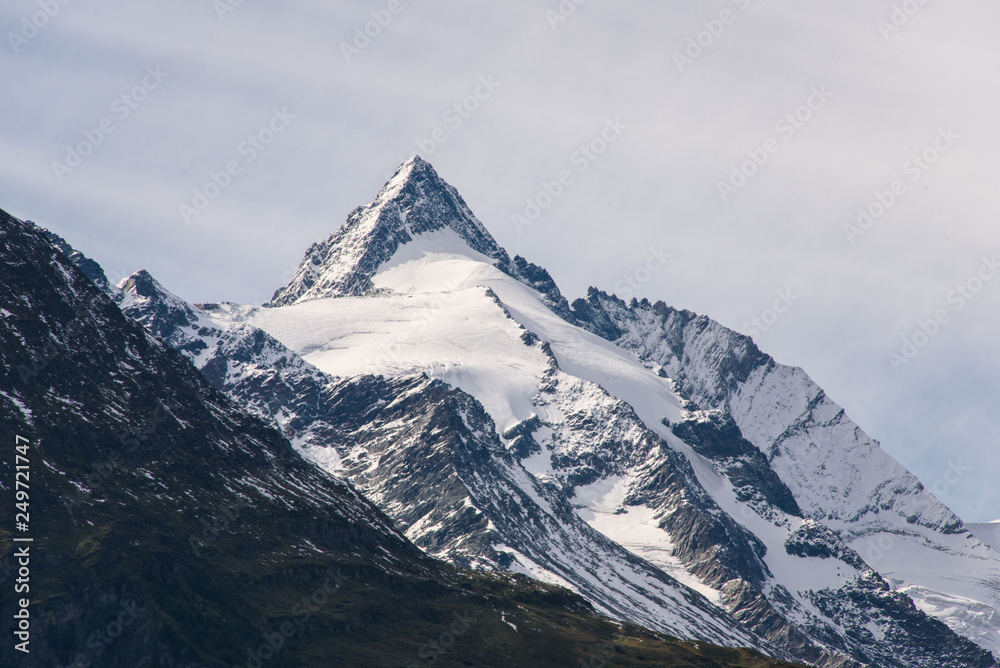 The view of Grossglockner, the highest mountain in Austria, with its characteristic pyramid-shaped peak covered with snow