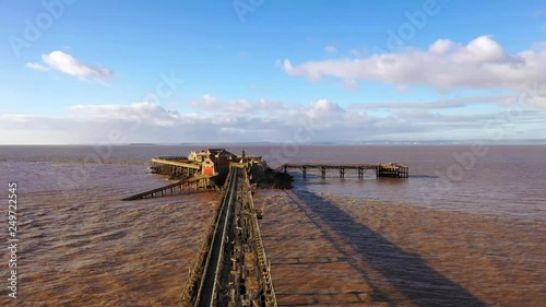 Aerial sequence depicting Birnbeck Pier, Weston-super-Mare, Somerset. The derelict pier, built in 1867 is the only pier in the country which links the mainland to an island. Closed to the public.
