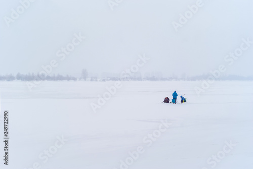 ice fishing in the winter landscape