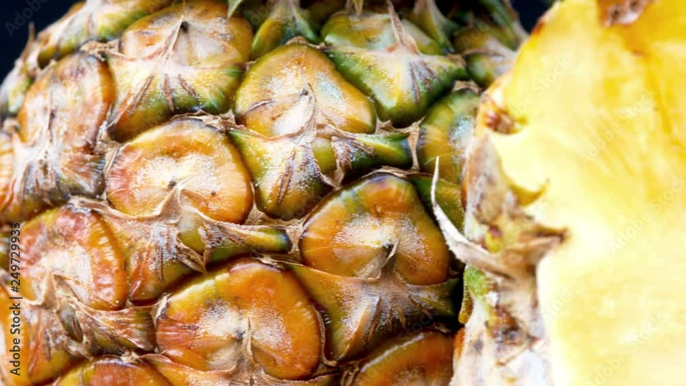 4k Dolly shot, a macro animation of a pineapple cut in half, saw the seeds and its texture that can be eaten. 4k Dolly shot, a macro animation of a pineapple cut in half, saw the seeds and its texture that can be eaten.
