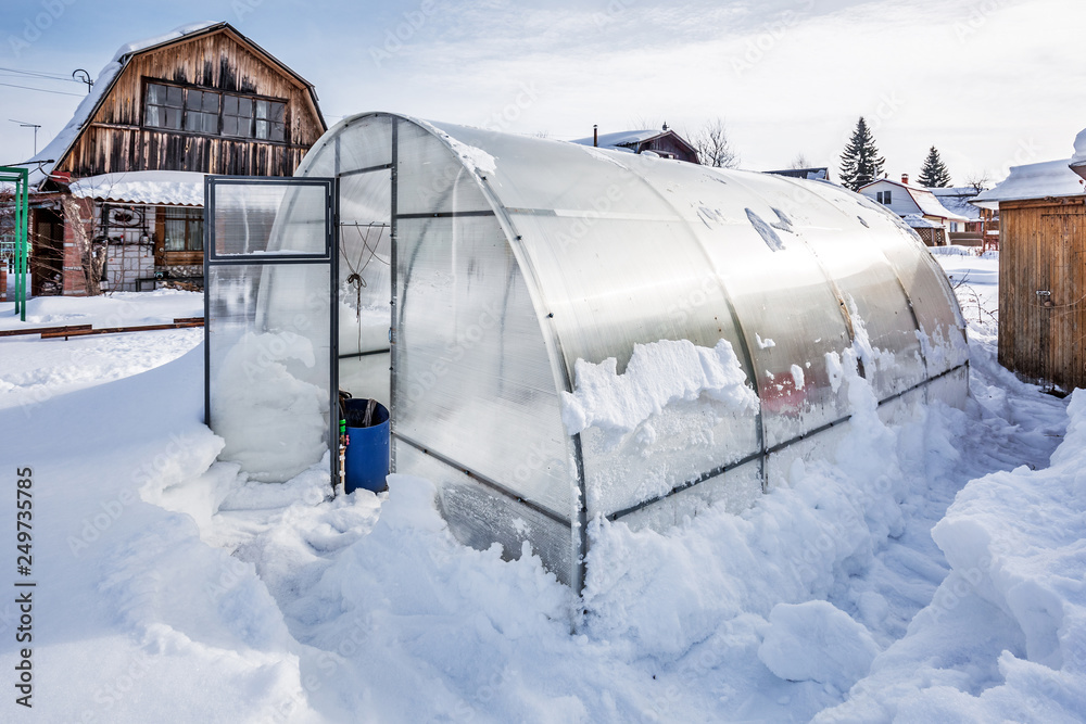 Polycarbonate greenhouse in winter. Western Siberia Polycarbonate greenhouse in winter. Western Siberia