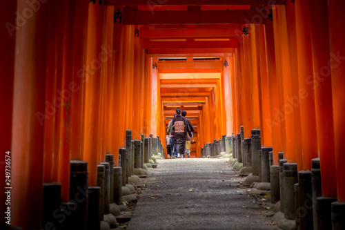 Walking the torri tunnel at shrine in japan © Joshua