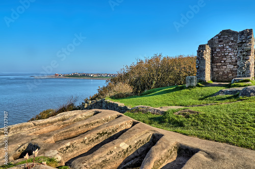 11th century stone graves in the ruins of the ancient St. Patrick's Chapel, Heysham, Lancashire, Northern England. photo