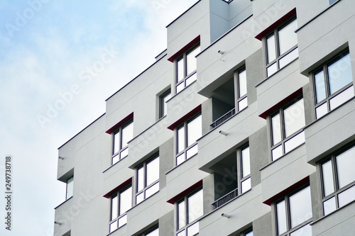 Modern apartment buildings on a sunny day with a blue sky. Facade of a modern apartment building