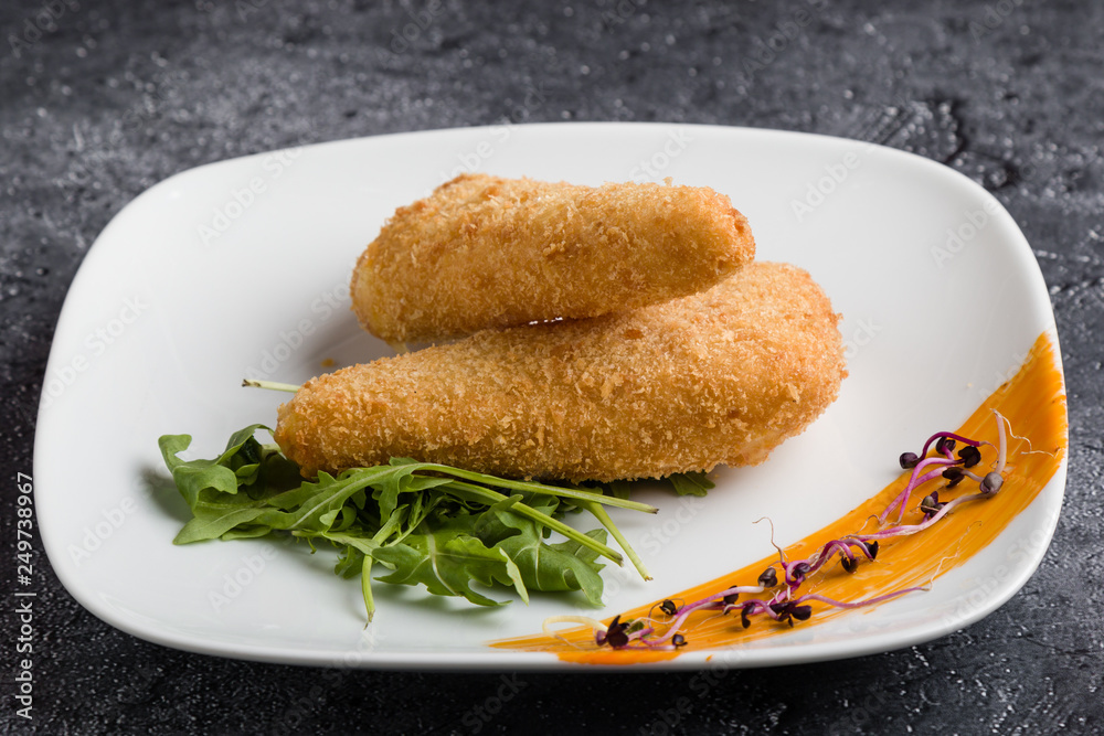 tasty fresh fried breaded cheese on white palte tasty fresh fried breaded cheese on white palte