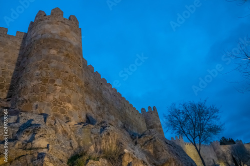 The magnificent medieval walls of Avila, Castile-Leon, Spain. A UNESCO World Heritage Site completed between the 11th and 14th centuries photo