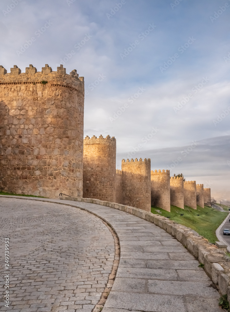 Obraz premium The magnificent medieval walls of Avila, Castile-Leon, Spain. A UNESCO World Heritage Site completed between the 11th and 14th centuries