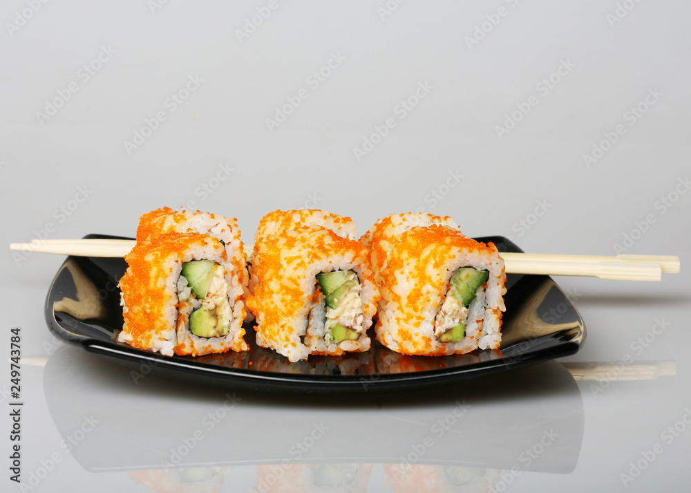 japanese rolls on black plate. japanese rolls on black plate.