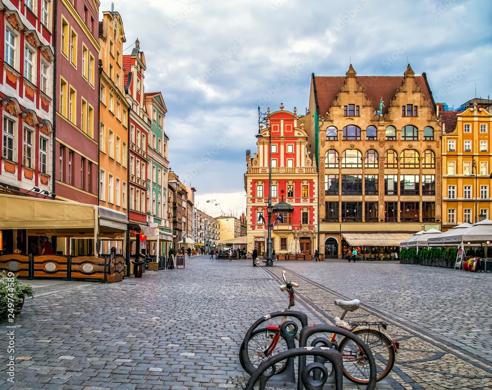 Colourful houses in the old town of Wroclaw, Poland near flower market and Market Square, a bicycle in the foreground, copy space.