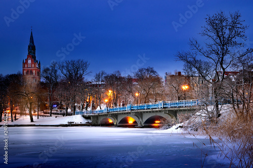 View of the bridge on the Elk lake in winter. Masuria, Poland.