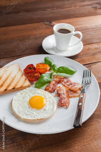 Fried eggs with bacon on breakfast