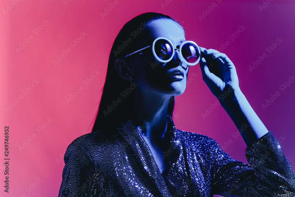 Premium Photo | Attractive woman with a retro hairstyle poses in a men's  suit and sunglasses