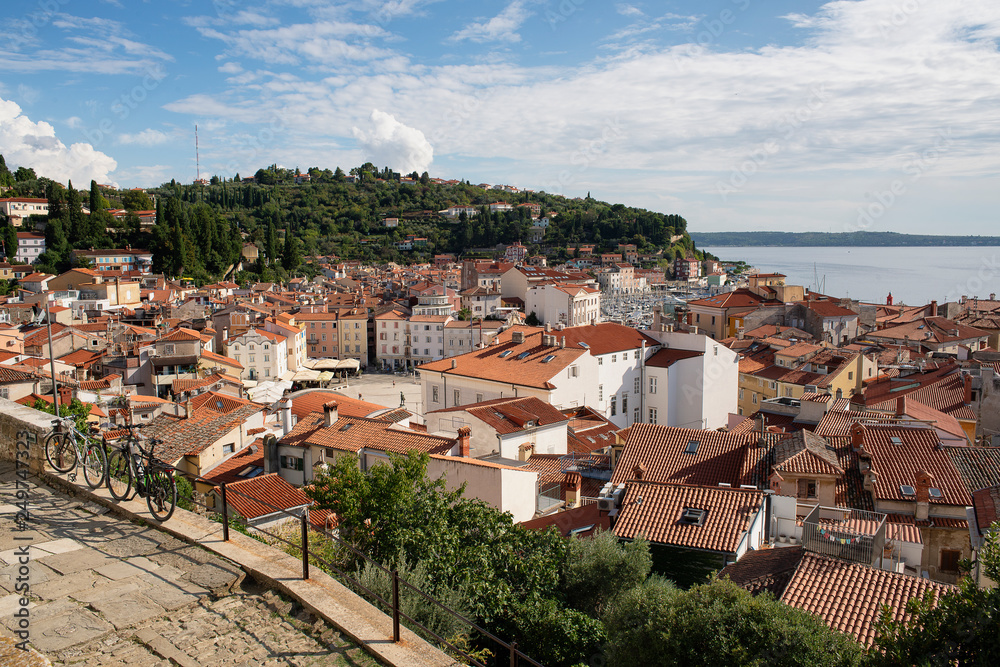 Panoramic view of old town of Piran/Pirano from medieval walls, on a sunny and blue day