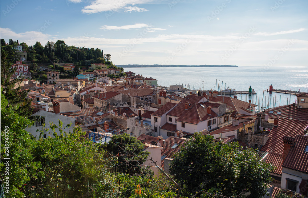 Panoramic view of old town of Piran/Pirano from medieval walls, on a sunny and blue day