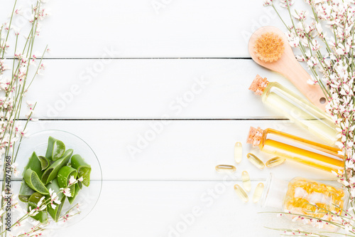 Beauty and fashion concept with spa set on pastel rustic wooden background.