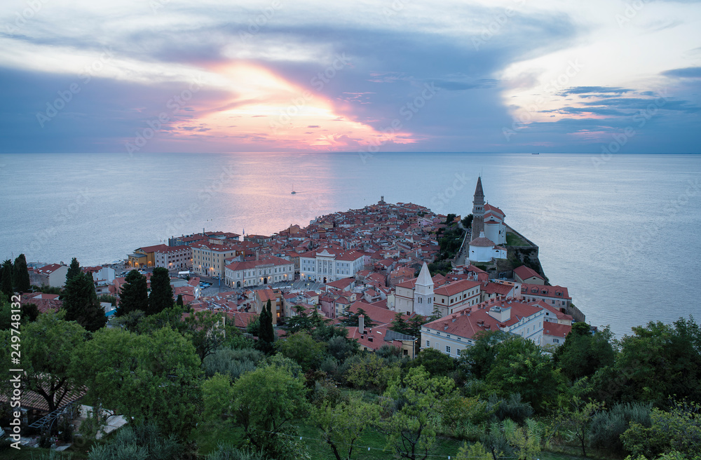 Panoramic view of the old town of Piran at the sunset, from the medieval old town walls