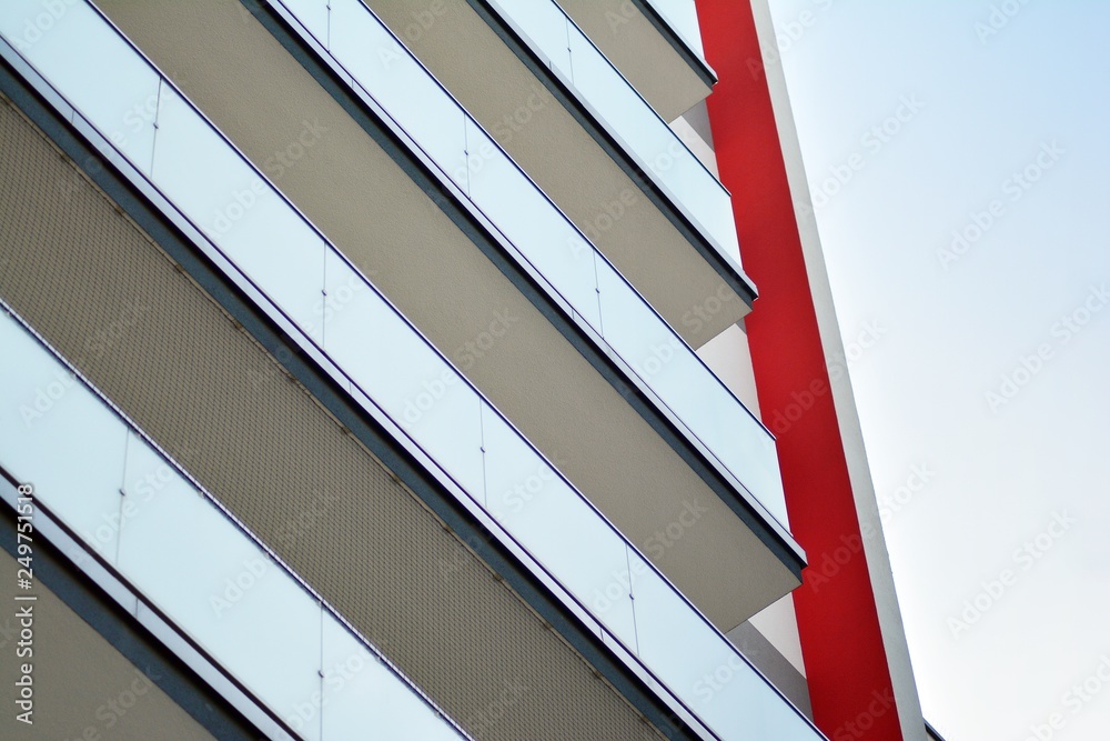 Modern apartment buildings on a sunny day with a blue sky. Facade of a modern apartment building Modern apartment buildings on a sunny day with a blue sky. Facade of a modern apartment building