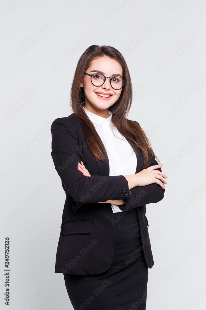 Gorgeous pretty woman crossed arms ,dressed on black suit at white background. Gorgeous pretty woman crossed arms ,dressed on black suit at white background.