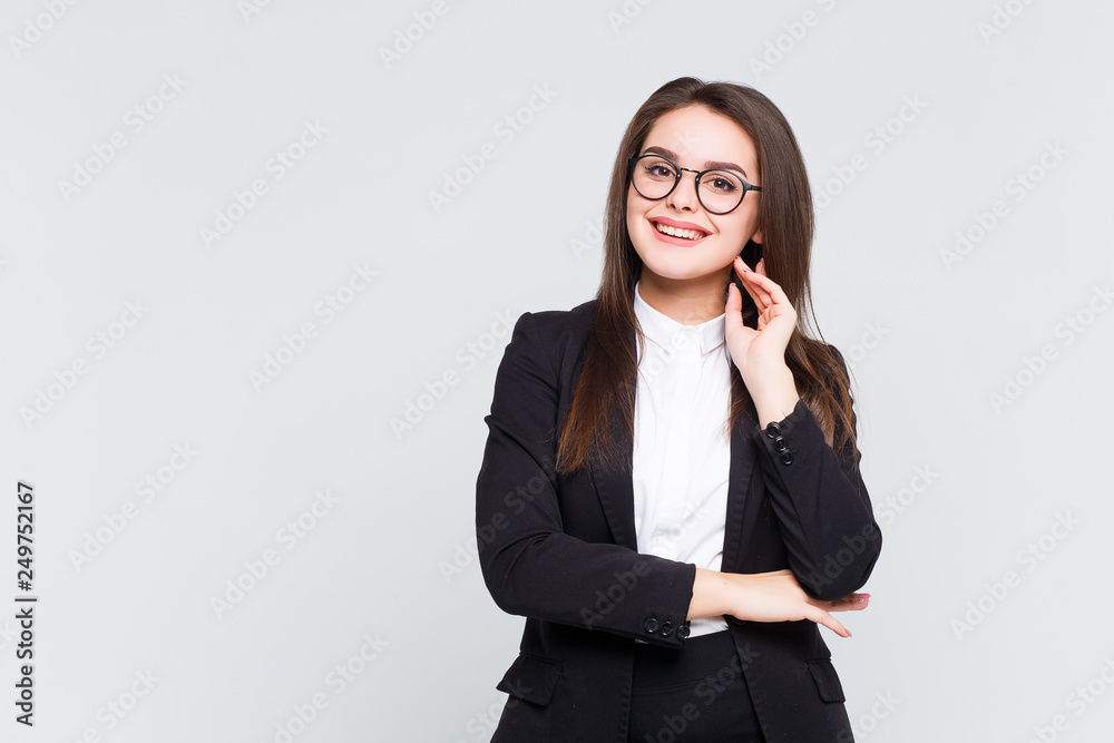 Isolated shot of joyful brenette young cute woman laughs joyfully as hears funny anecdote from friend, has long brown hair. Happiness and business concept. Isolated shot of joyful brenette young cute woman laughs joyfully as hears funny anecdote from friend, has long brown hair. Happiness and business concept.