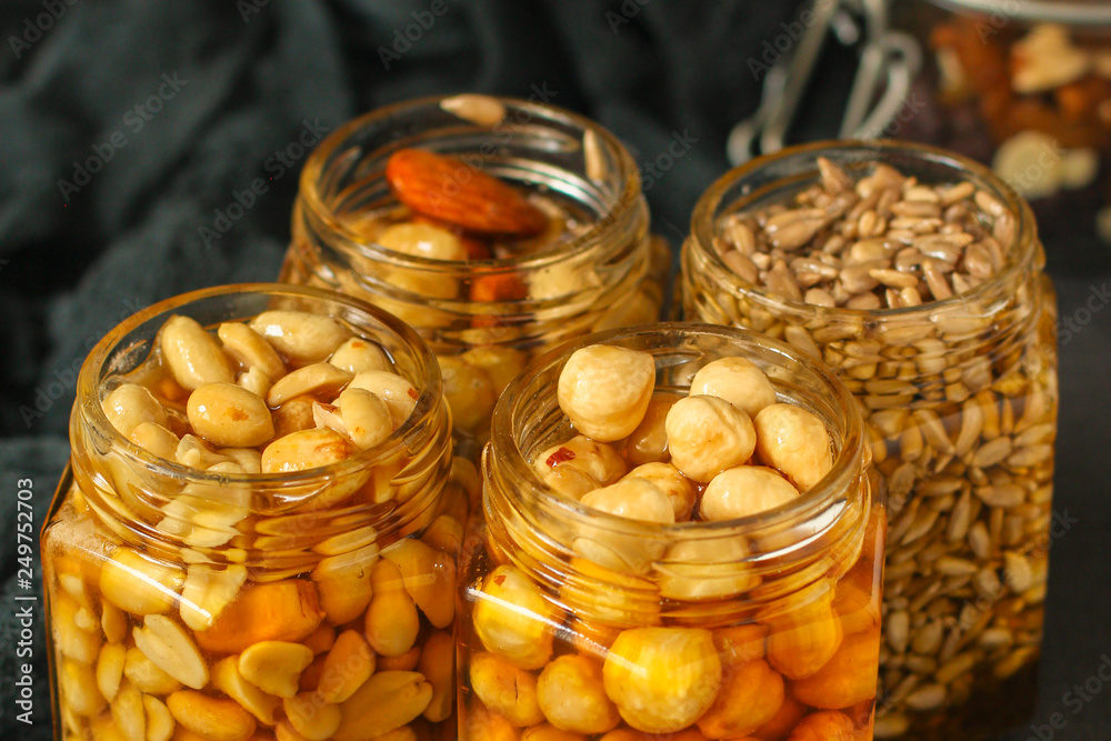 honey and nuts mix grain, seeds tasty and healthy dessert. top food background. copy space honey and nuts mix grain, seeds tasty and healthy dessert. top food background. copy space