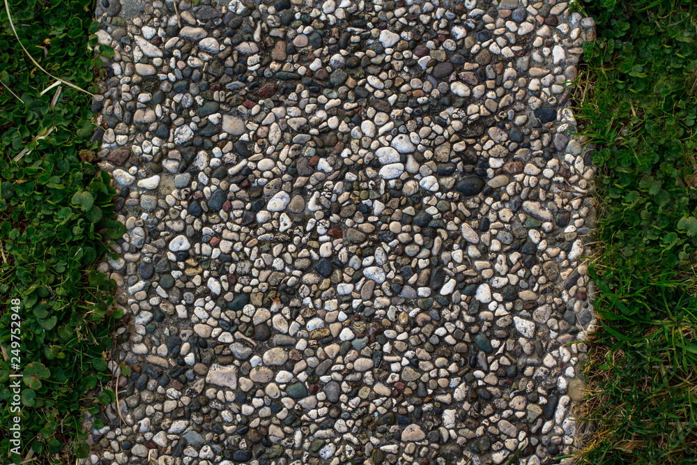 texture tiles of small stones and green grass texture tiles of small stones and green grass