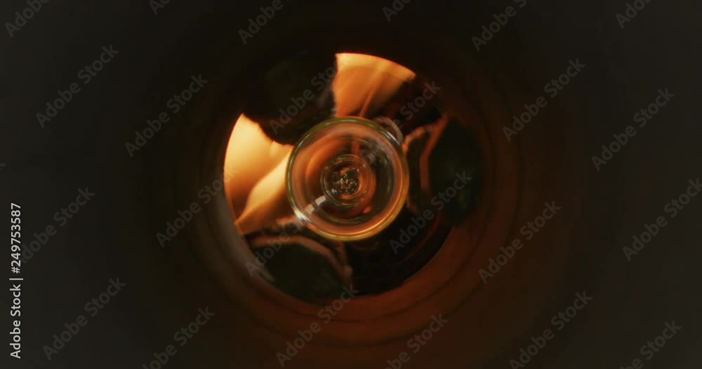 Slow motion macro of glass blower working with flame on a handmade art piece of glass from precious crystal in a workshop. Slow motion macro of glass blower working with flame on a handmade art piece of glass from precious crystal in a workshop.