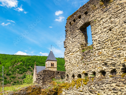Esch-Sur-Sure castle ruins, exterior partial view with the church tower in the background, at Esch-sur-Sure, canton of Wiltz, district of Diekirch, Luxembourg photo