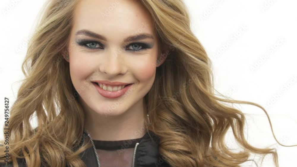 Beautiful smiling woman with a long blond hair. Happy fashion model with a stylish makeup. Beautiful smiling woman with a long blond hair. Happy fashion model with a stylish makeup.
