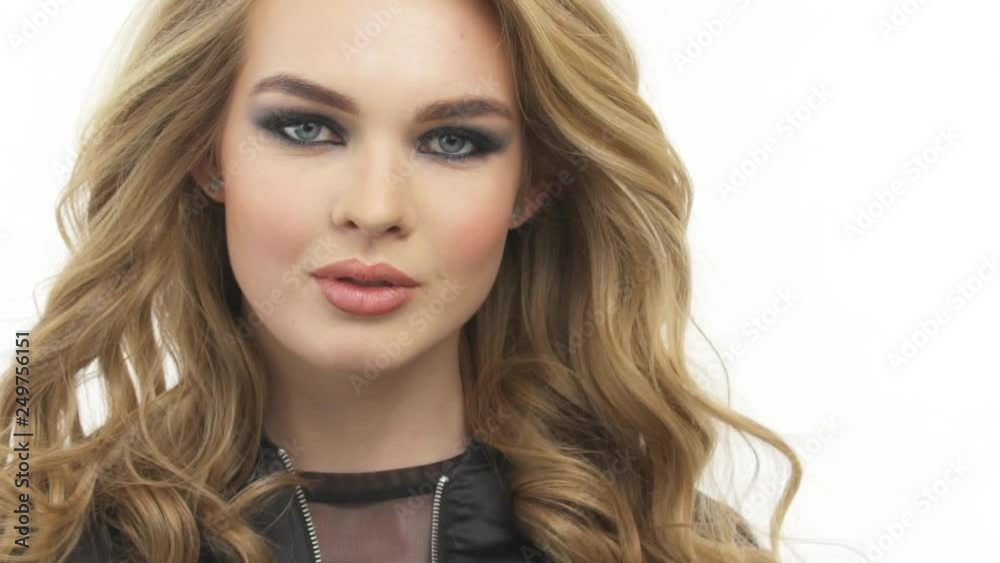 Beautiful woman with a long blond hair. Fashion model with a stylish makeup. Beautiful woman with a long blond hair. Fashion model with a stylish makeup.