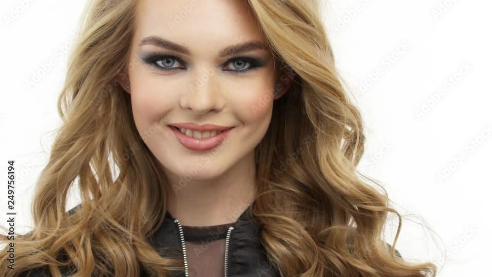 Beautiful smiling woman with a long blond hair. Happy fashion model with a stylish makeup. Beautiful smiling woman with a long blond hair. Happy fashion model with a stylish makeup.