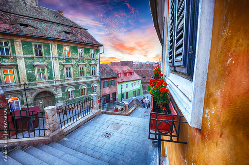 Fototapeta Naklejka Na Ścianę i Meble -  Fantastic sunset on Ocnei street neat to the Small Square in Sibiu
