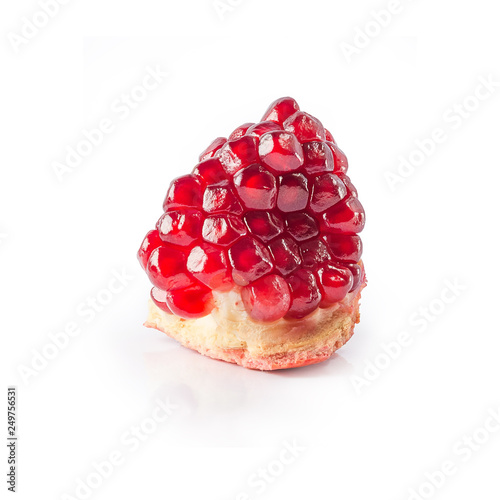 Segment of ripe pomegranate isolated on white background