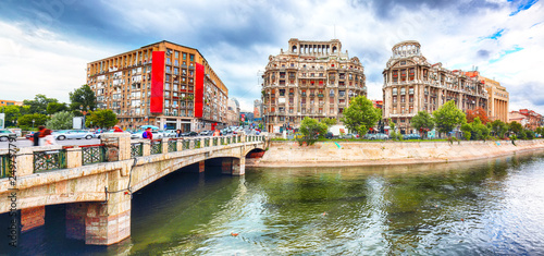 Antique building view in Old Town Bucharest city - capital of Romania and Dambrovita river