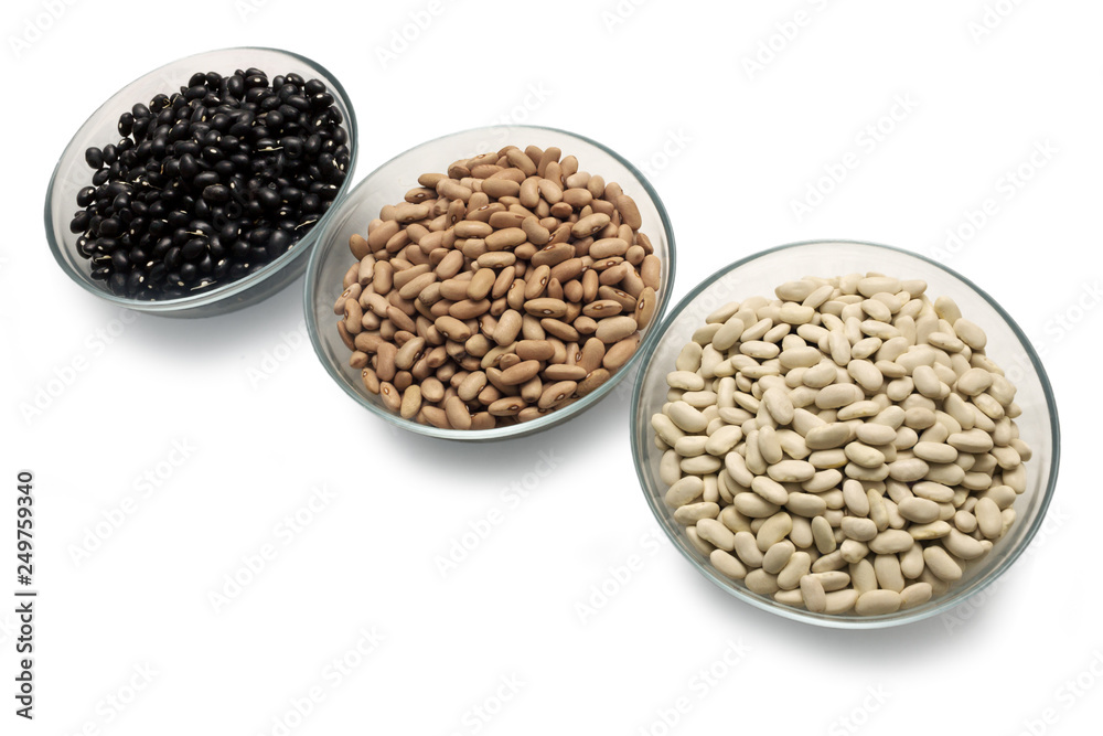 Beans are black, brown and white in glass bowls Beans are black, brown and white in glass bowls